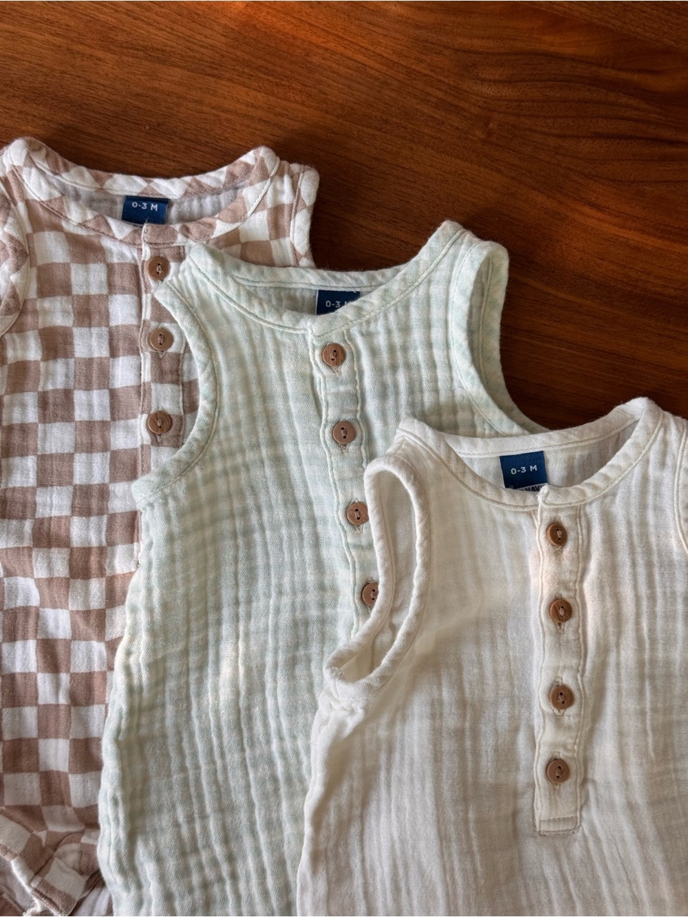 Old Navy Muslin Baby Rompers in Cream, Light Green Stripes, and Taupe Checkers